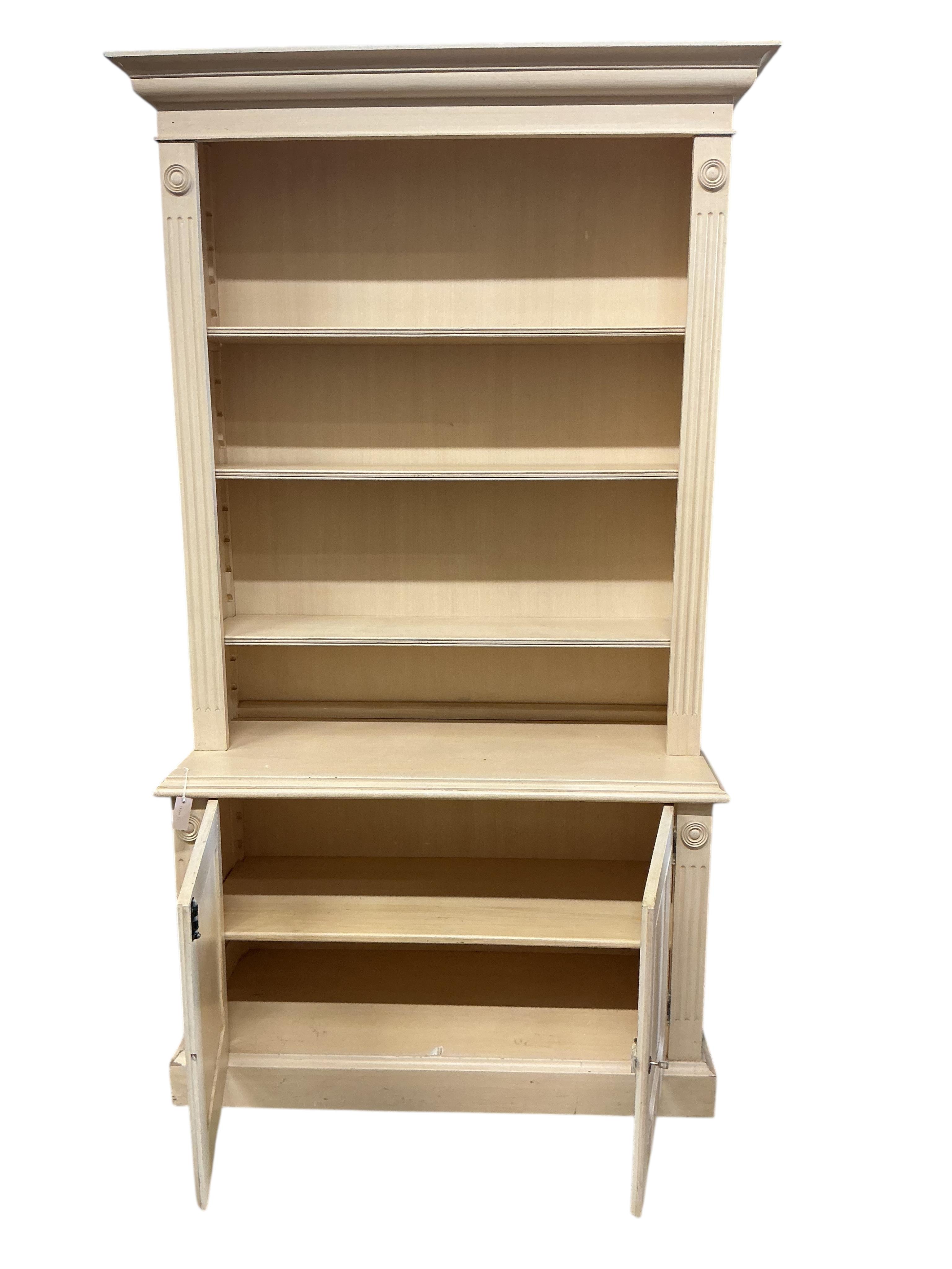 A Georgian style painted library bookcase, width 126cm, depth 50cm, height 230cm